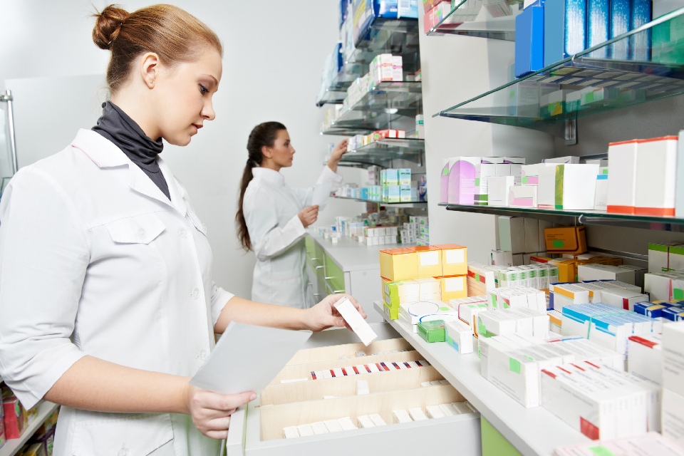 2 ladies working in the pharmacy