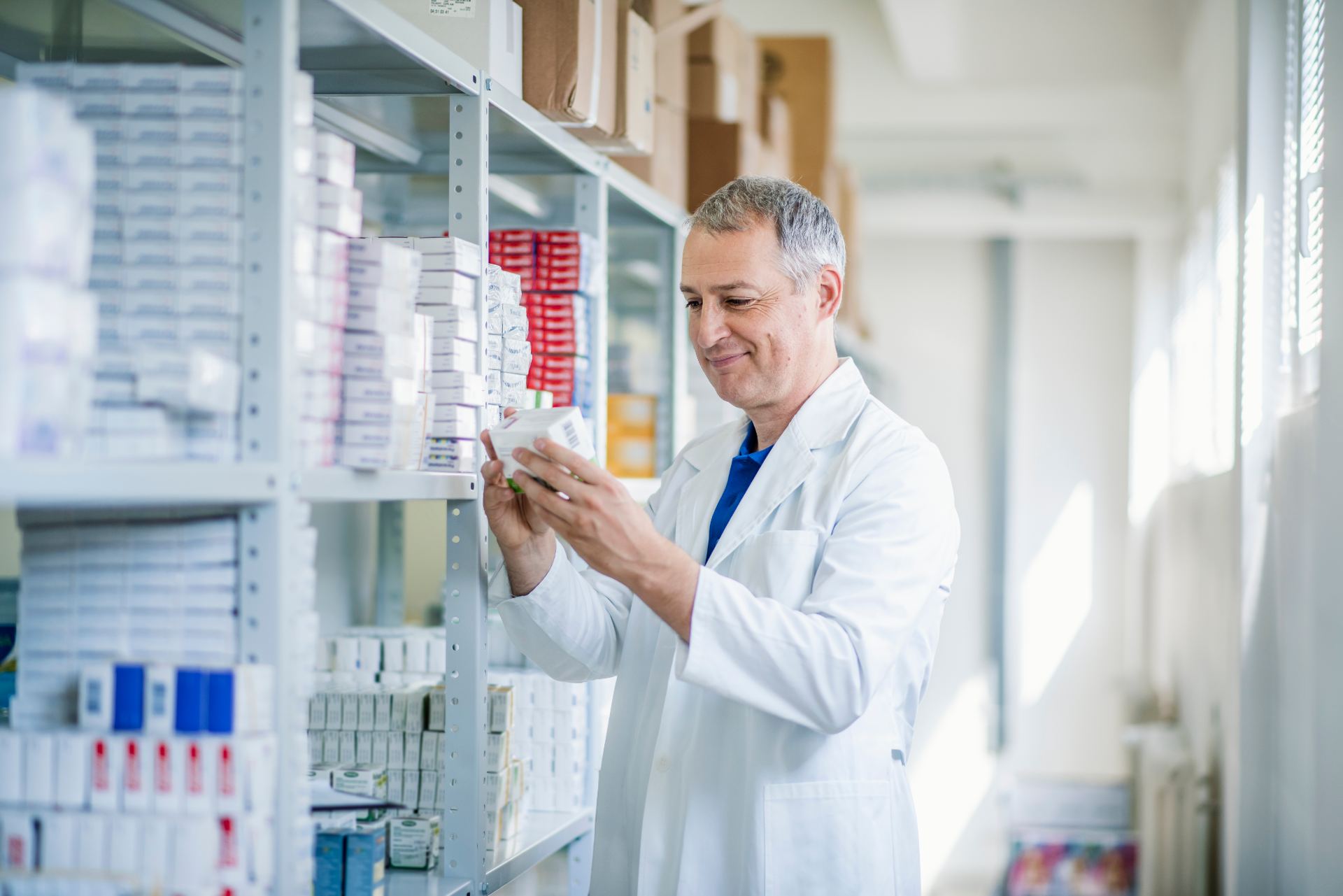 Doctor looking at medicines in the pharmacy