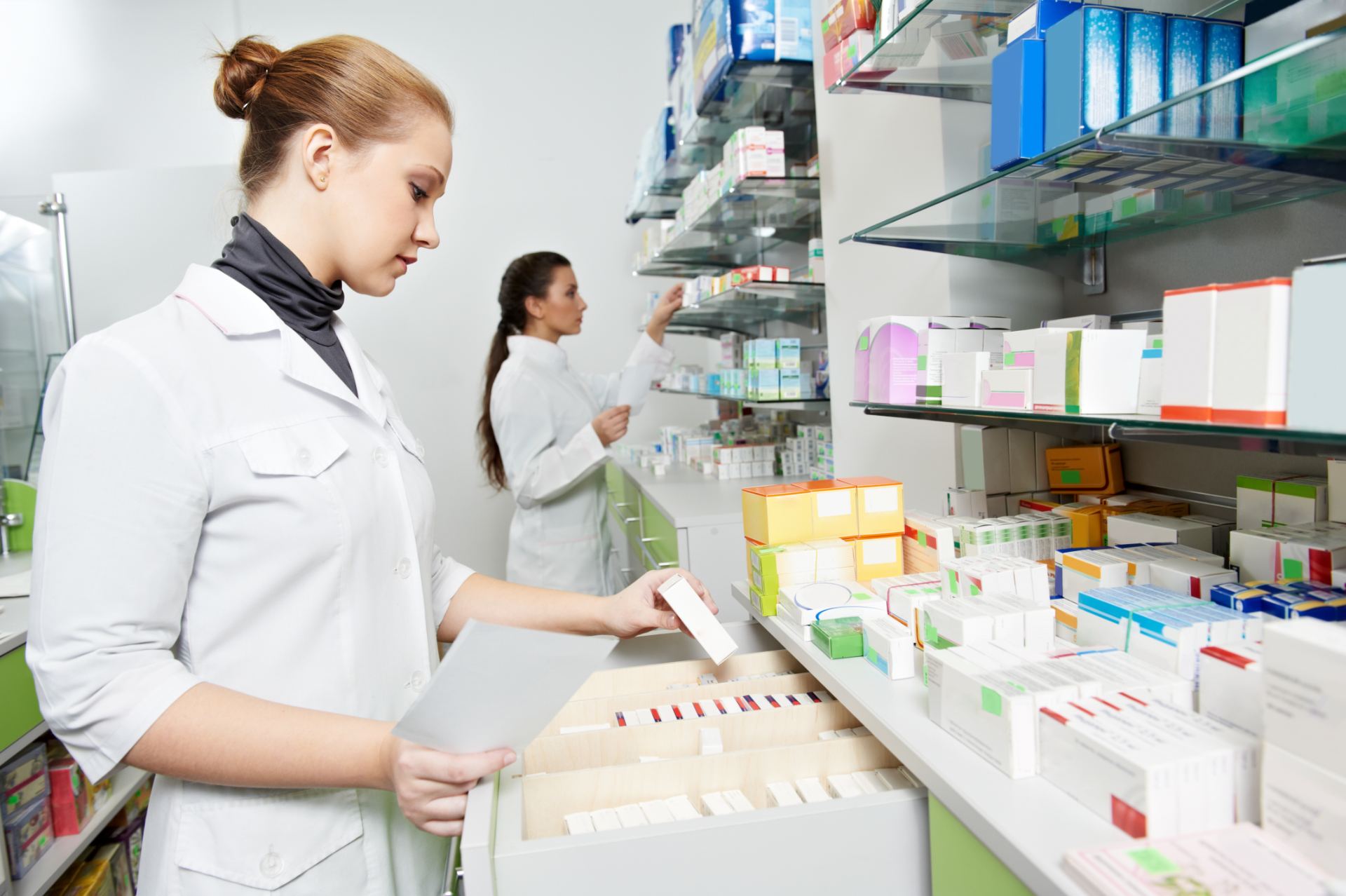 2 ladies working in the pharmacy