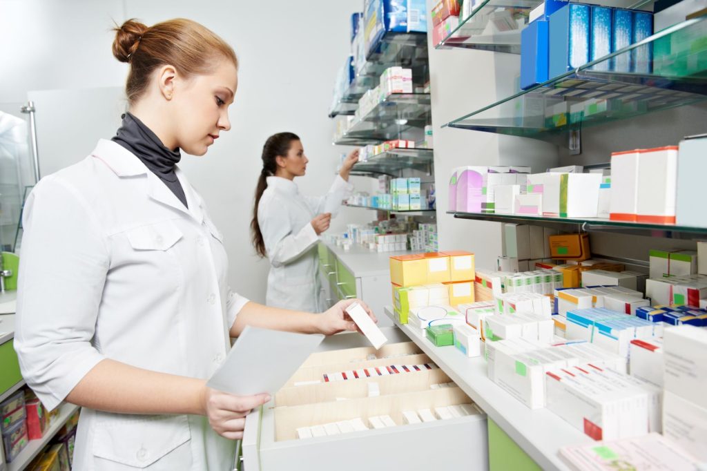 2 ladies working at the pharmacy